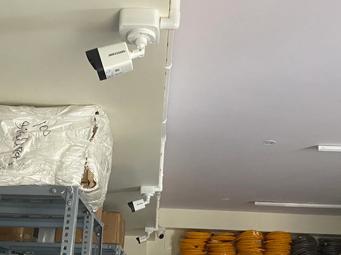 Warehouse multi-camera CCTV installation with conduit cabling